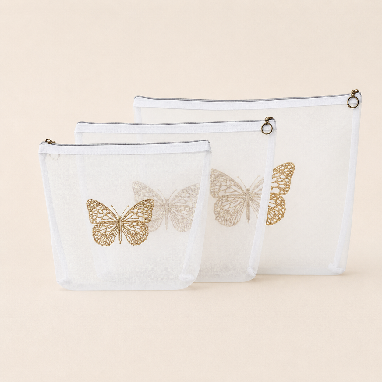 SET X 3 COSMETIQUERAS MARIPOSA DORADA
